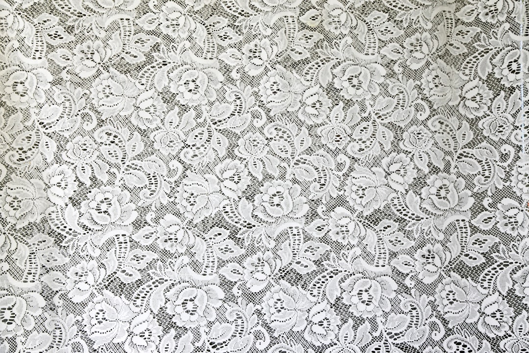 white and black floral textile