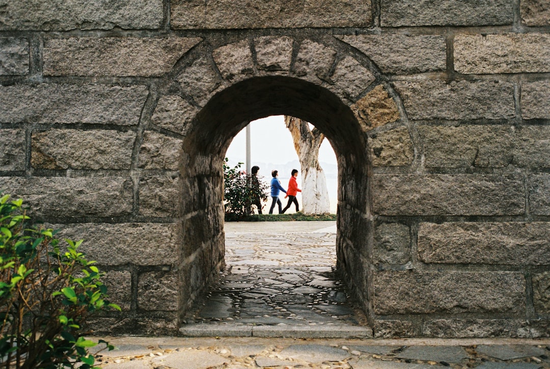 people walking on tunnel during daytime