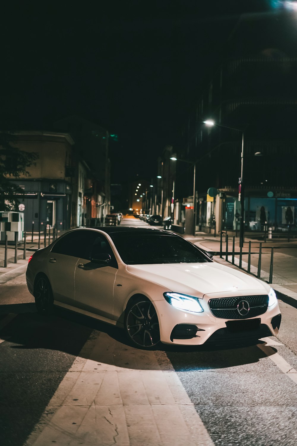 white mercedes benz coupe on road during night time