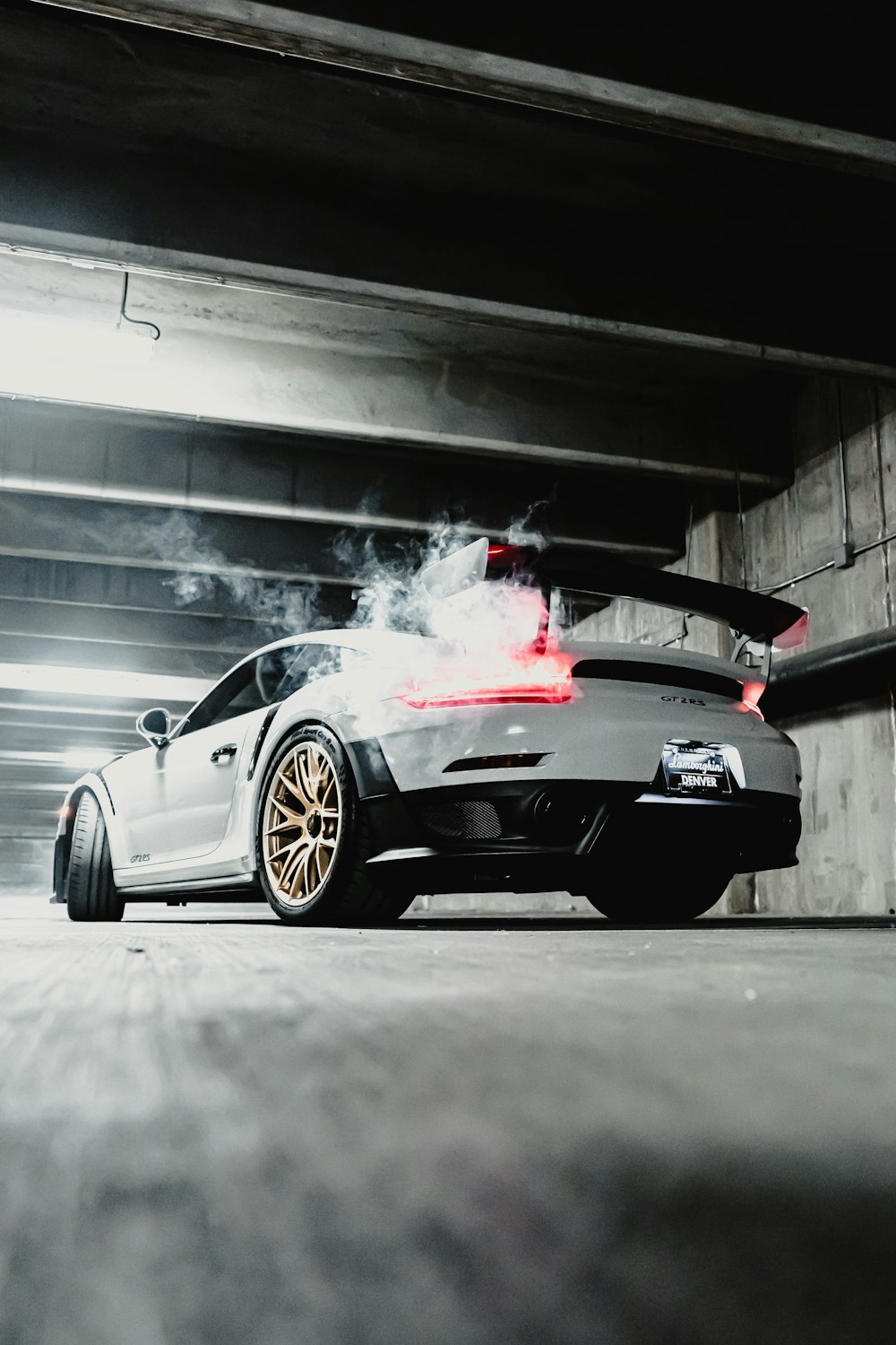 black porsche 911 parked in garage