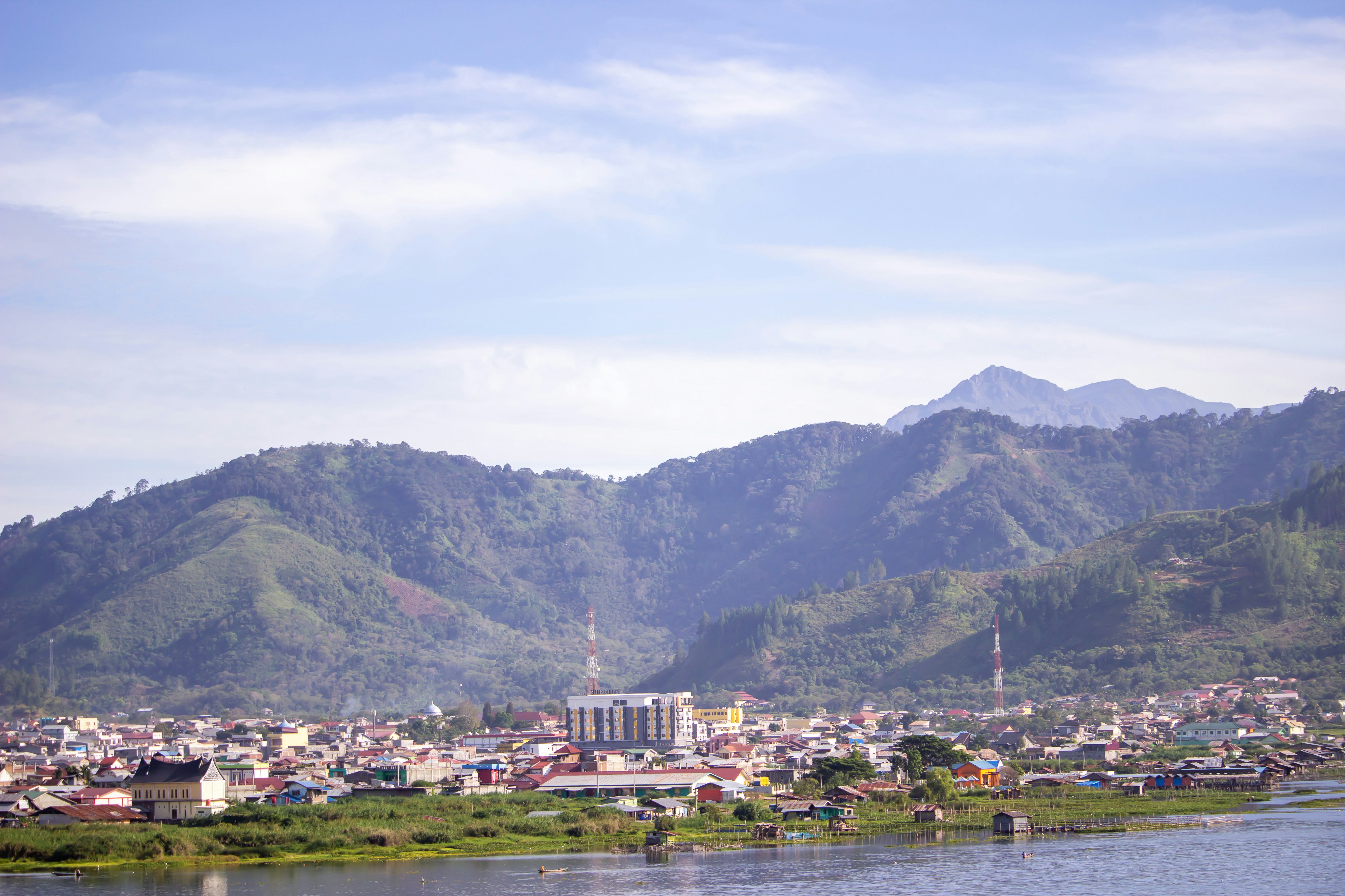 city near mountain during daytime