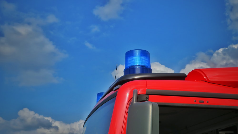 blue and red plastic water jug