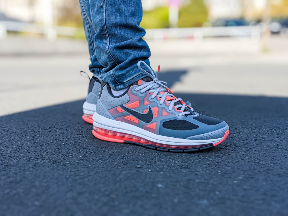 Person wearing gray and red nike athletic shoe photo – Free Germany Image  on Unsplash