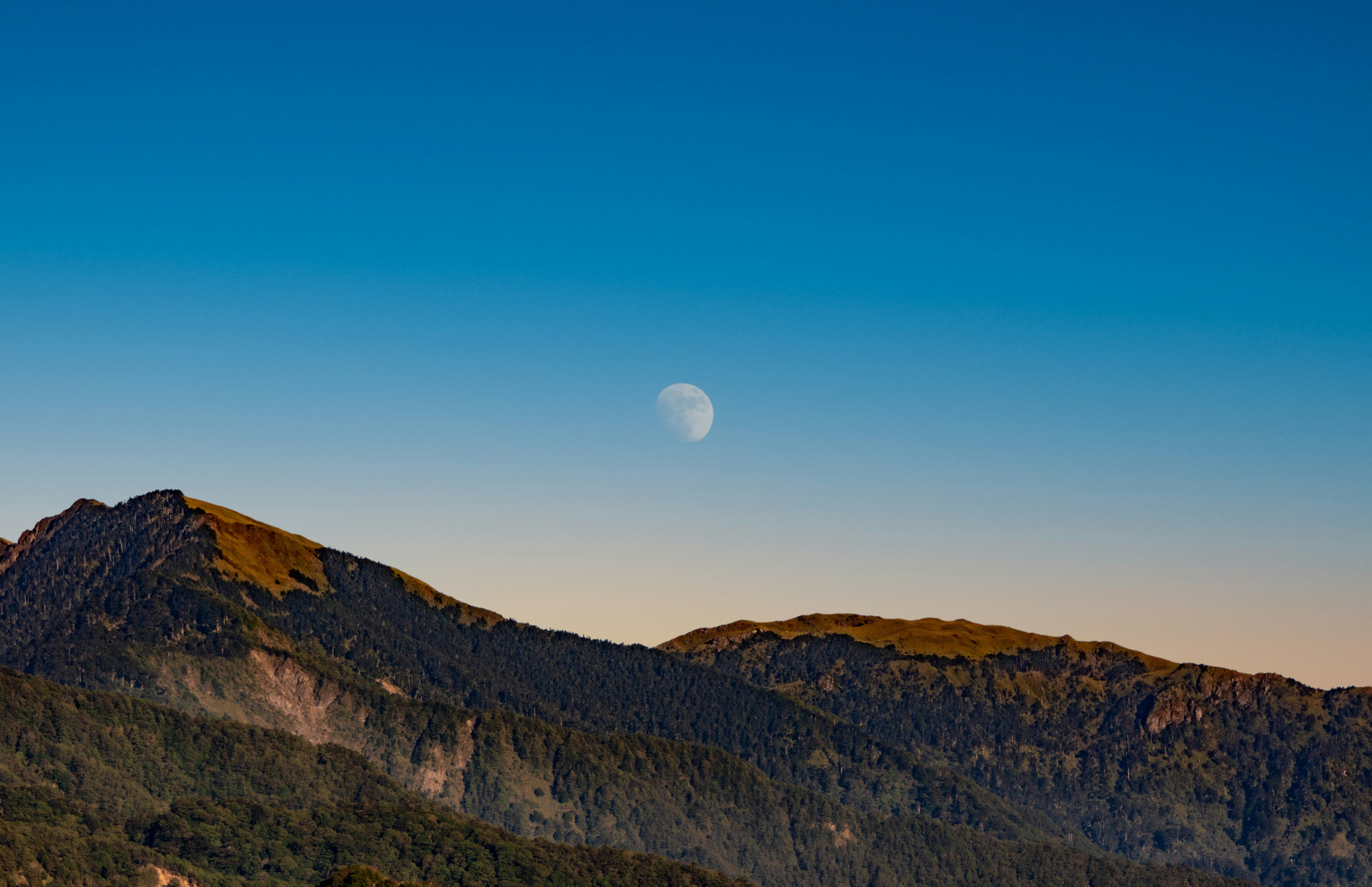 brown mountain under blue sky during daytime