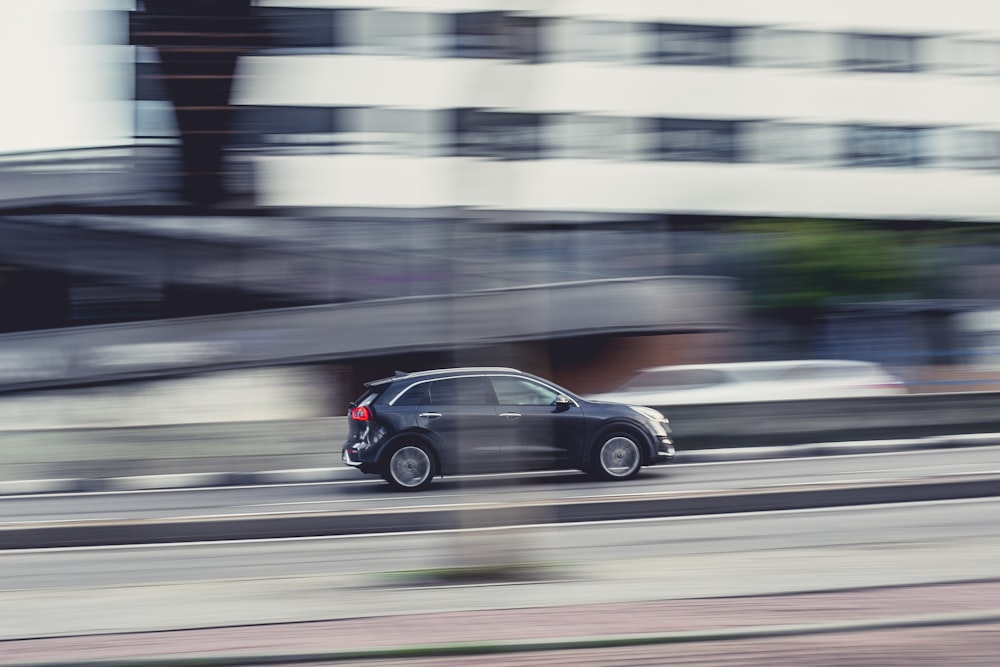 black sedan on road during daytime