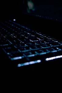 Close-up of a secure USB hardware key glowing softly on a dark surface.