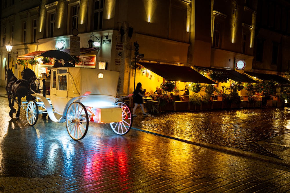 white and red bicycle on road during night time