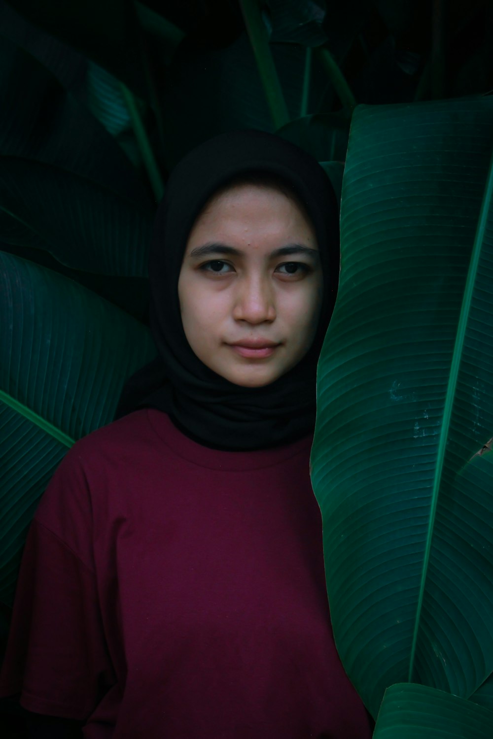 woman in red hijab and green long sleeve shirt