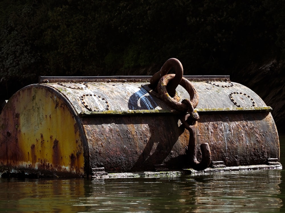 brown metal chain on body of water during daytime