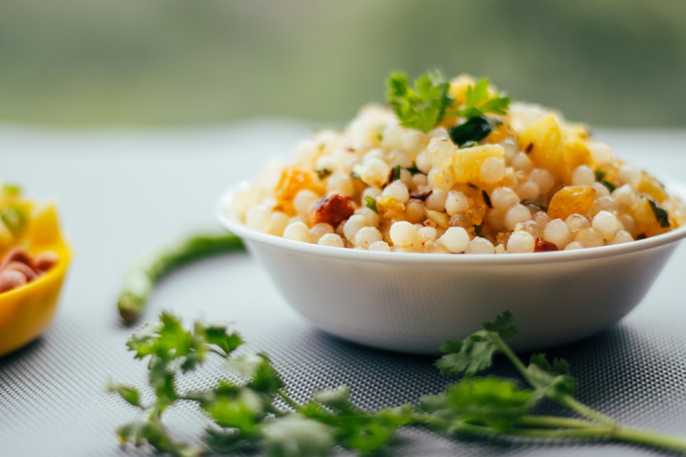 white ceramic bowl with green vegetable