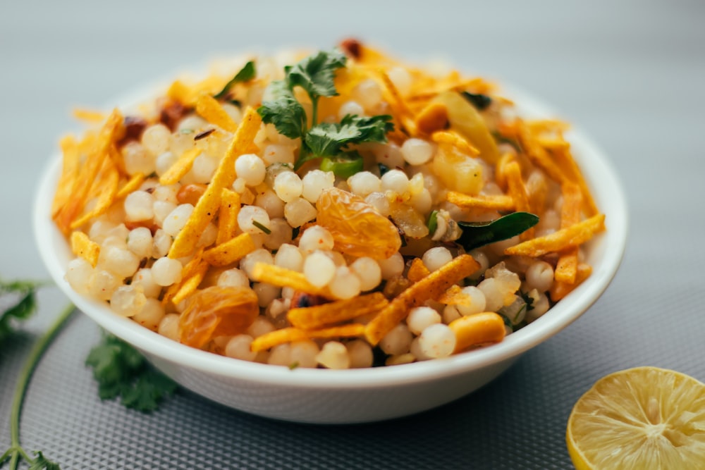 yellow and green vegetable dish on white ceramic bowl