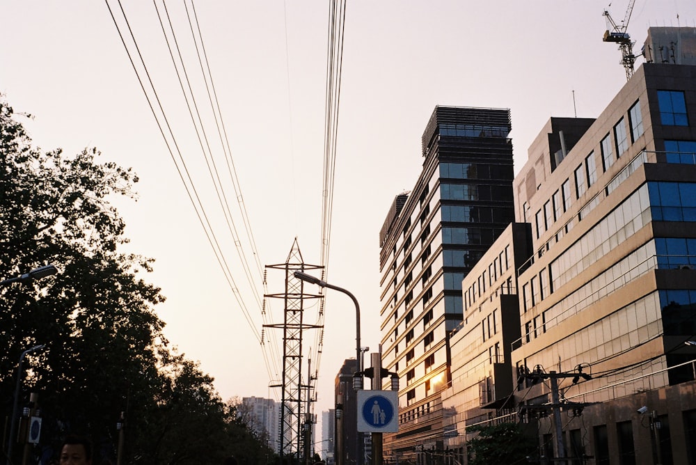 blue bus on road near high rise buildings during daytime