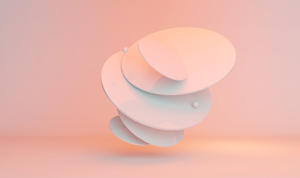 white round plastic toy on blue surface
