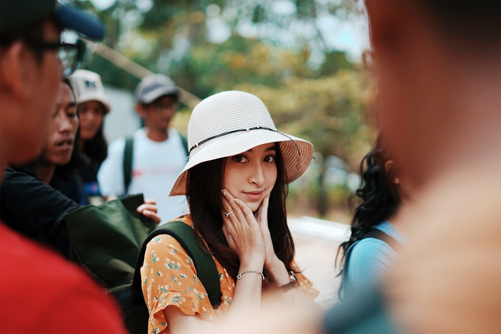 woman in white hat and blue dress