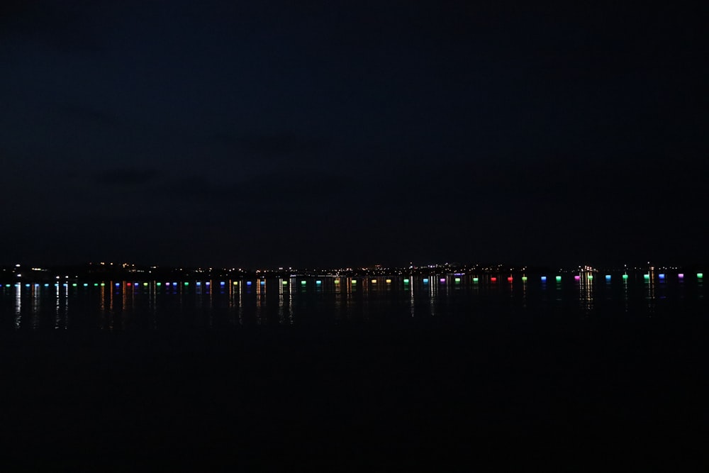 dock on body of water during night time