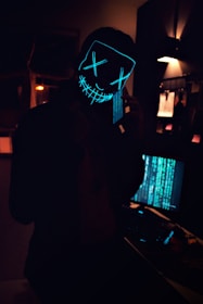 man in black jacket standing near table lamp