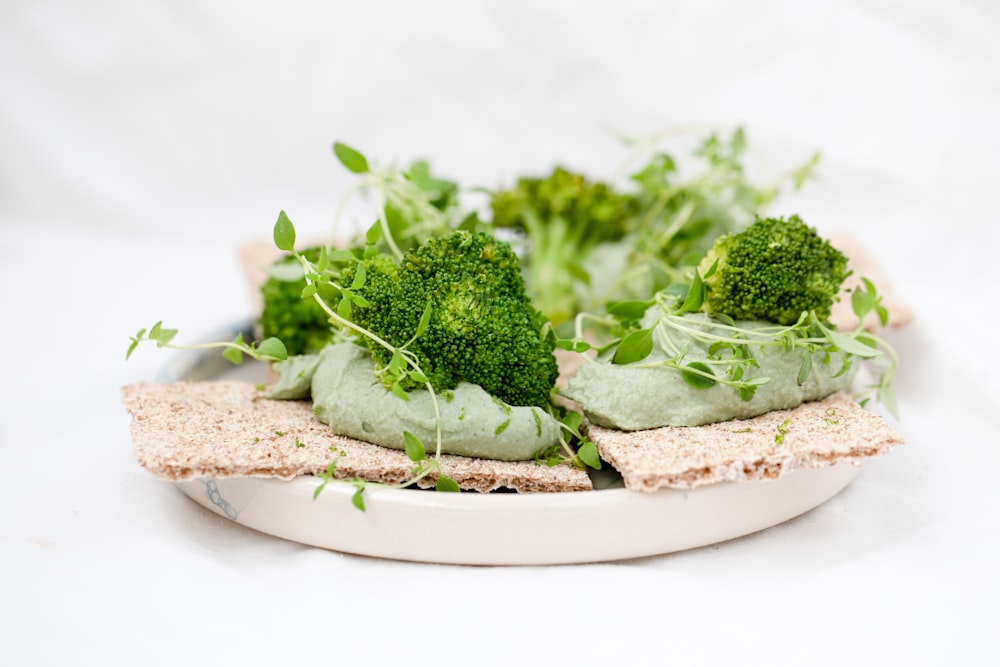 green vegetable on brown wooden round plate