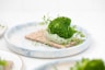 green vegetable on white ceramic plate