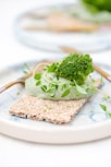 green vegetable on white ceramic plate