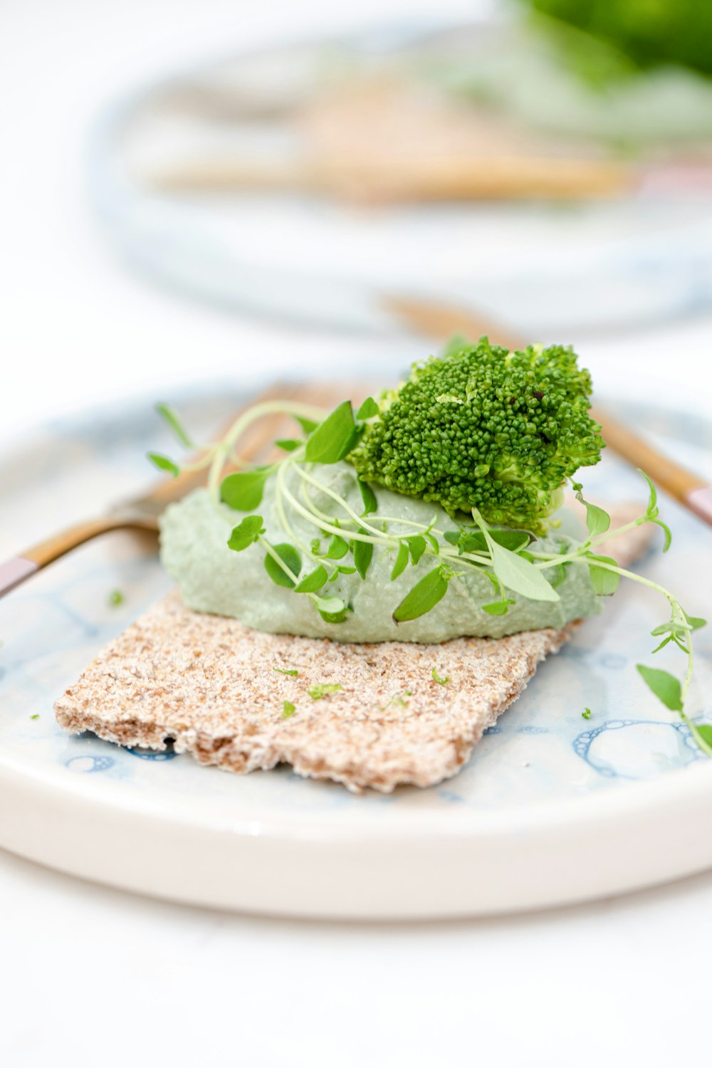 green vegetable on white ceramic plate