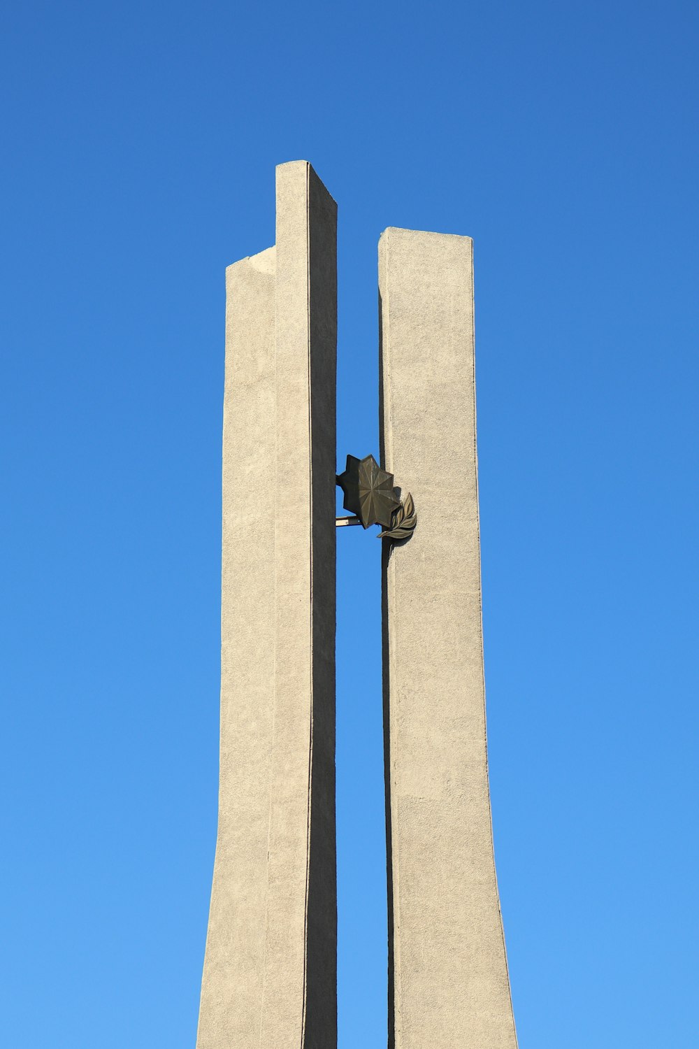 gray concrete cross with cross on top