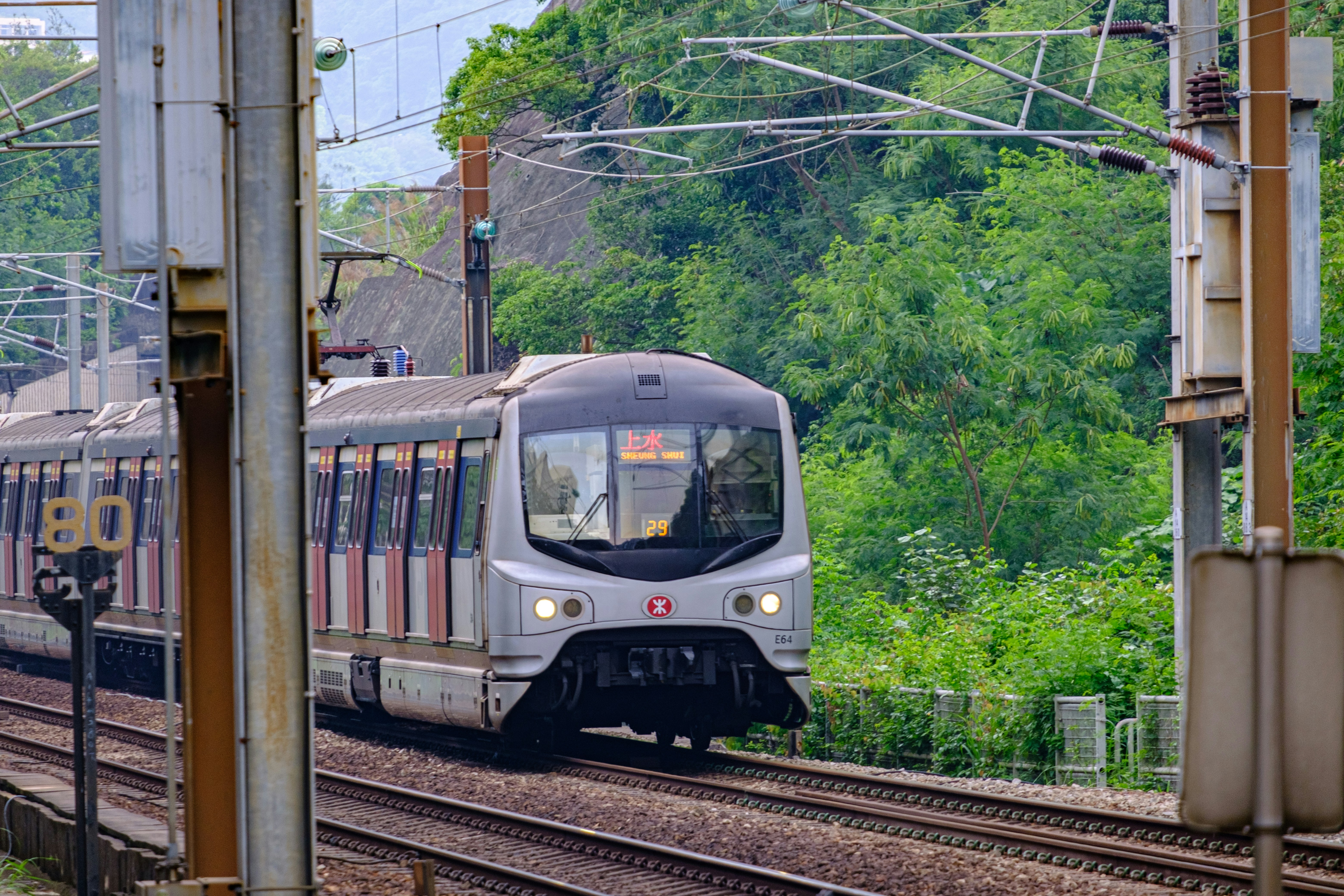 white and black train on rail tracks