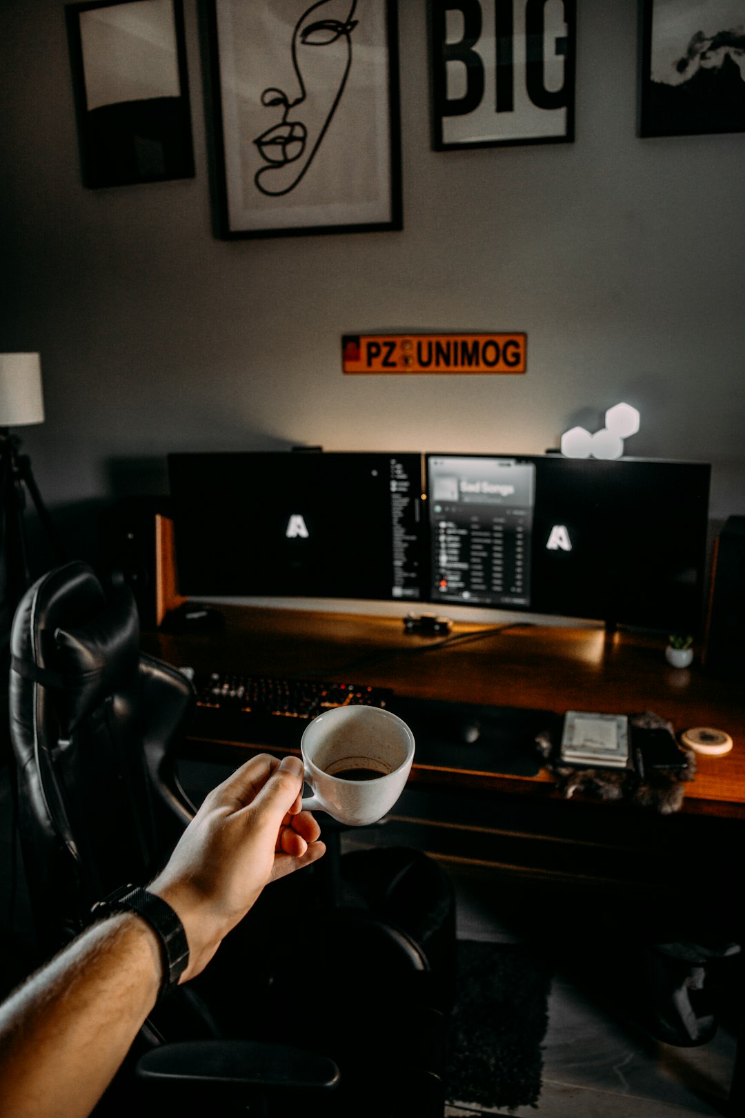 person holding white ceramic mug