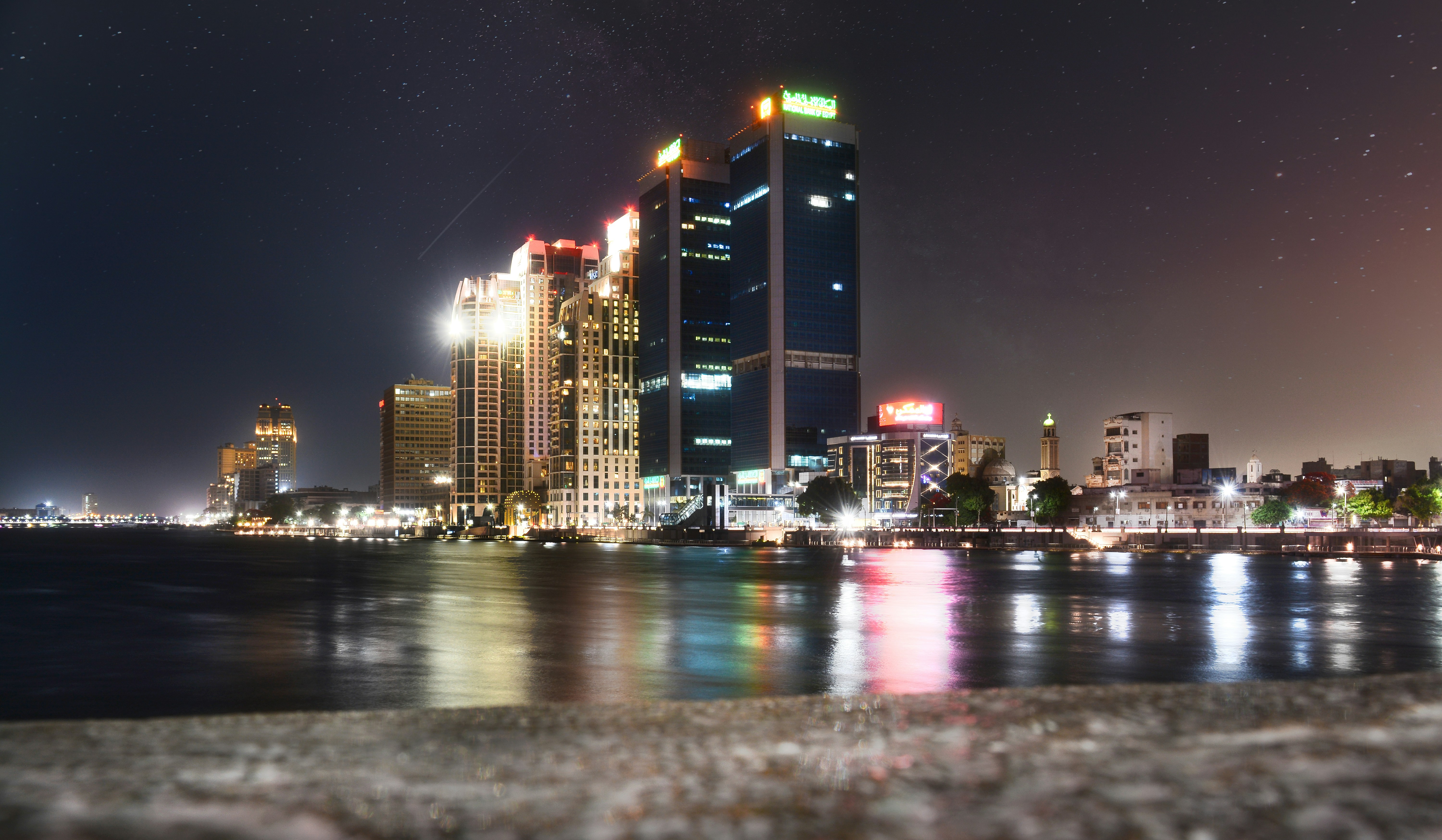 a view of a city at night from across the water, Zamalk at night