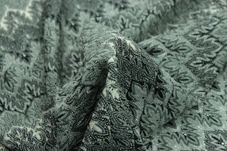 green and black floral textile