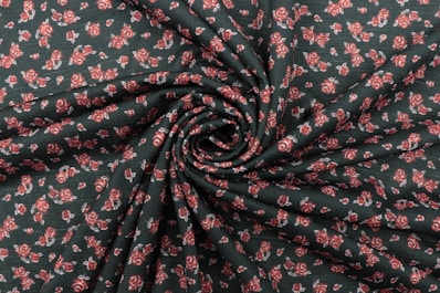 black red and white floral textile
