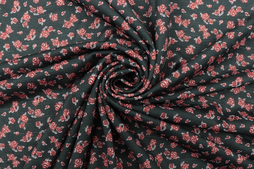 black red and white floral textile