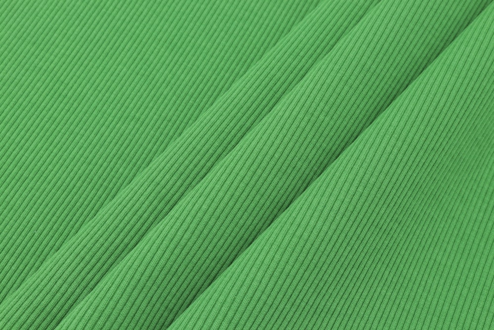 green and white striped textile