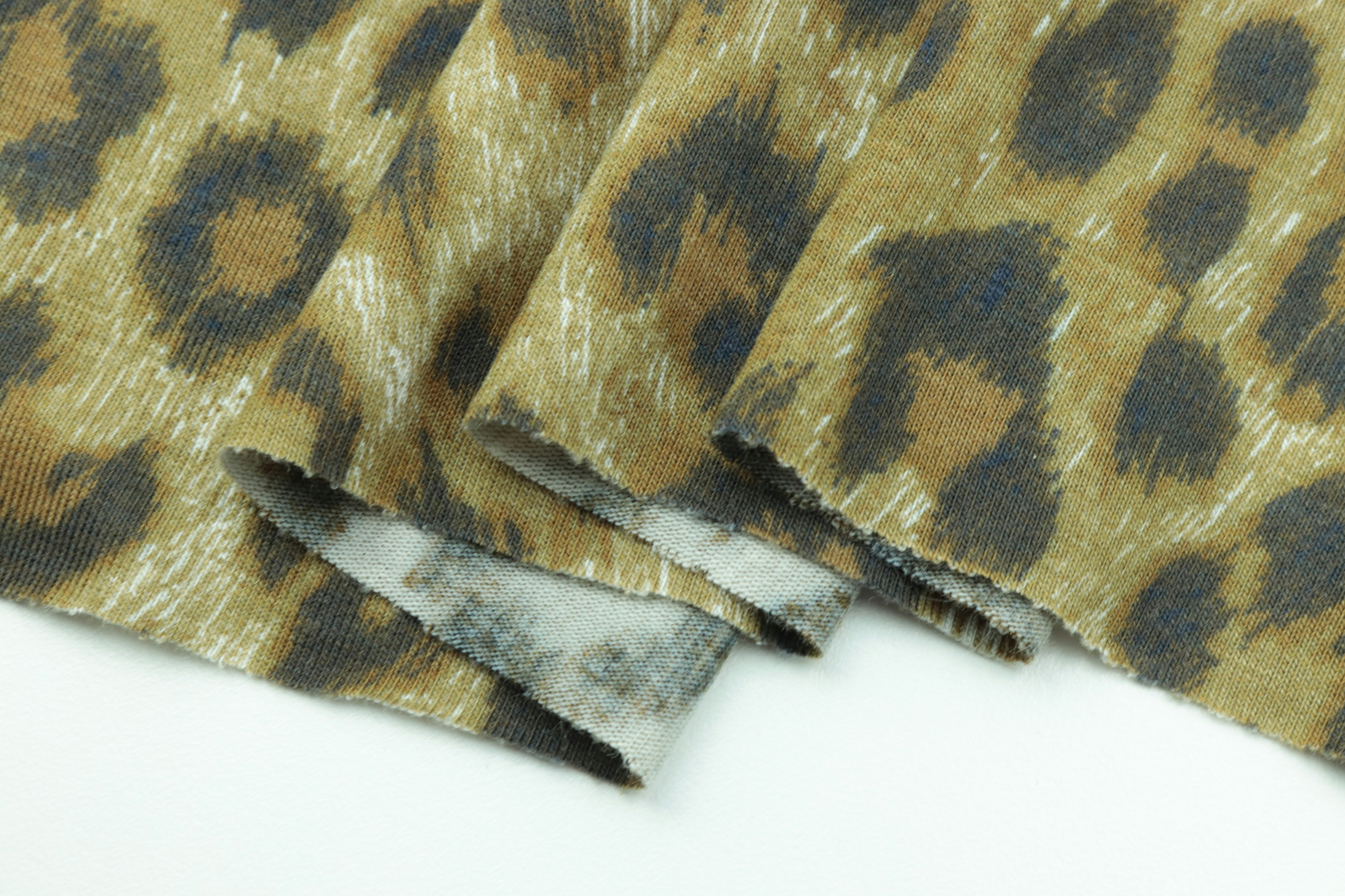 brown and beige textile on white surface