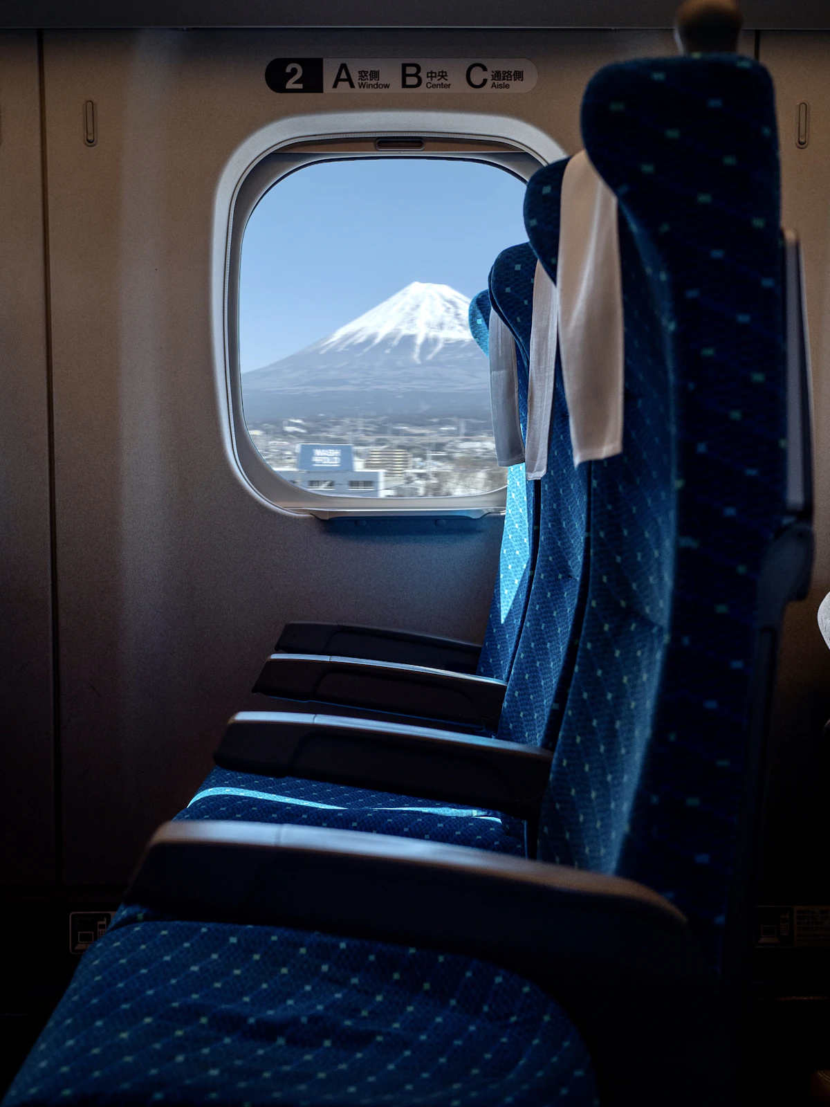 Mount Fuji seen through the window of a Shinkansen bullet train