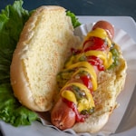 hotdog sandwich with tomato and lettuce