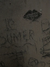 Raw canvas with splattered paint and visible pencil sketches beneath.