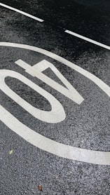 white and black round arrow sign