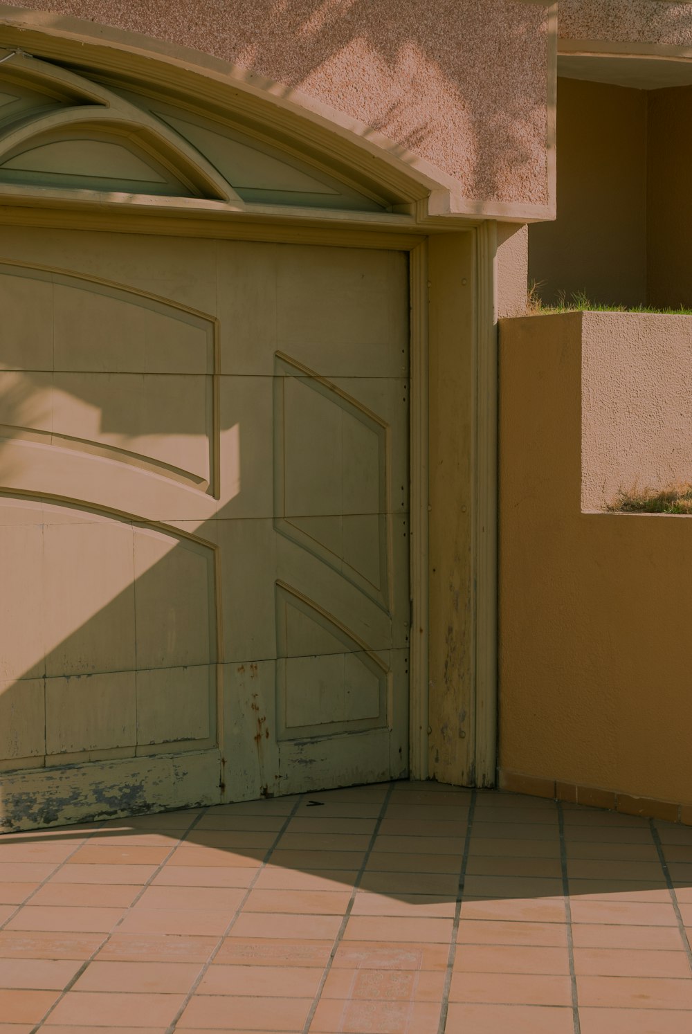 white wooden door near green grass during daytime