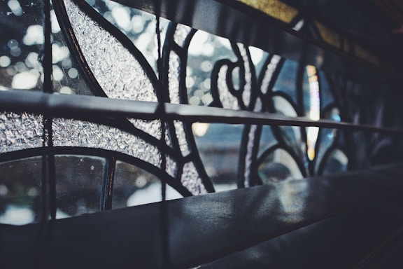 A close-up of a beautifully etched glass panel showcasing intricate floral patterns with soft natural light highlighting the details.