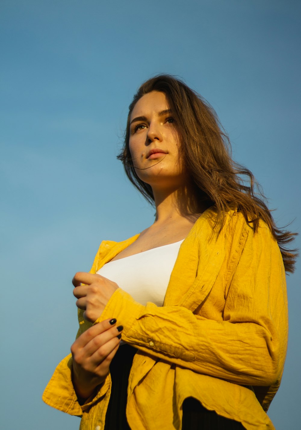 woman in yellow cardigan smiling