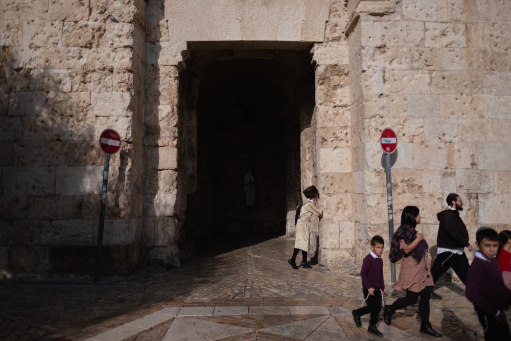 people walking on gray concrete pathway during daytime