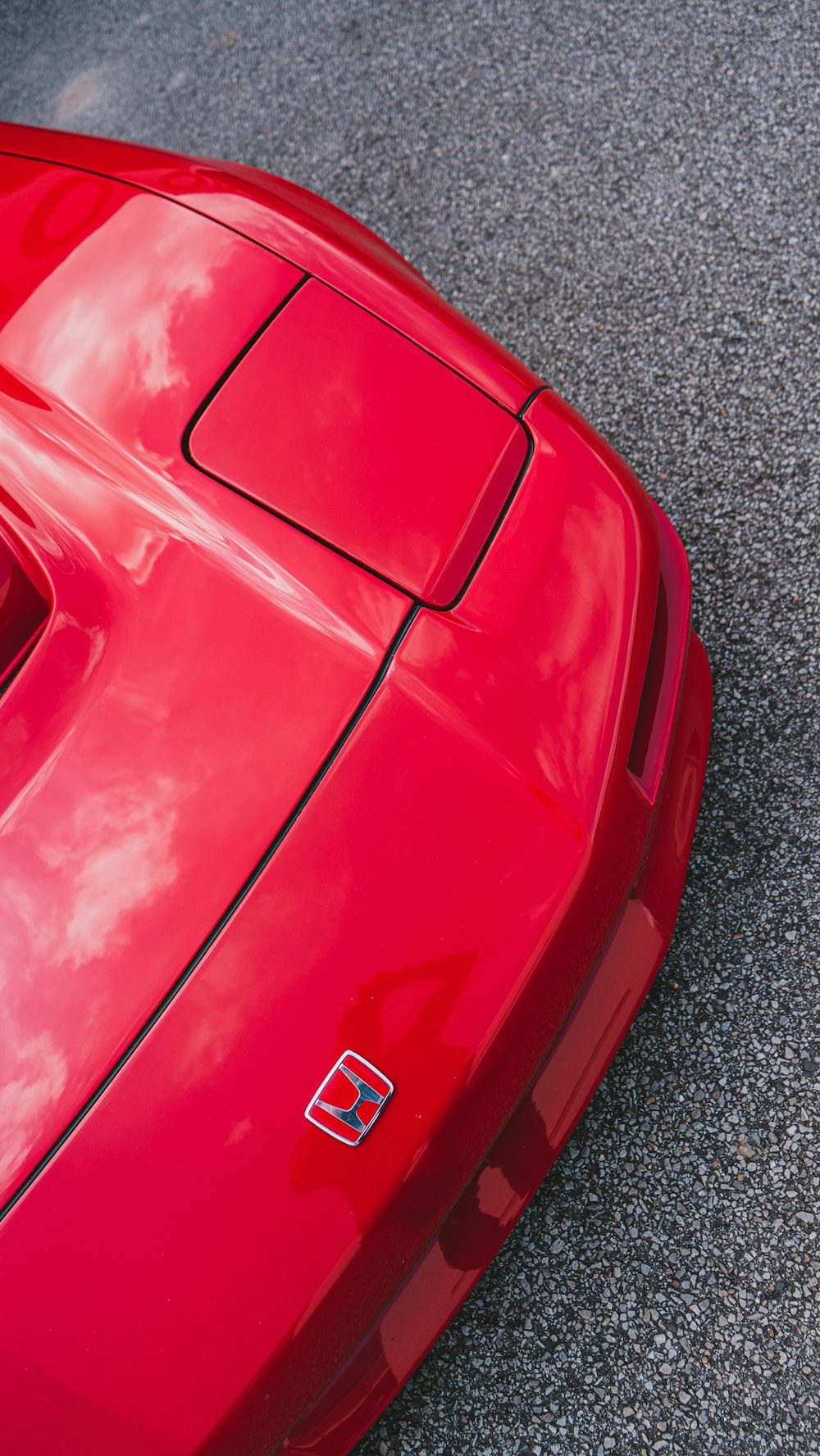 red porsche 911 on grey concrete pavement