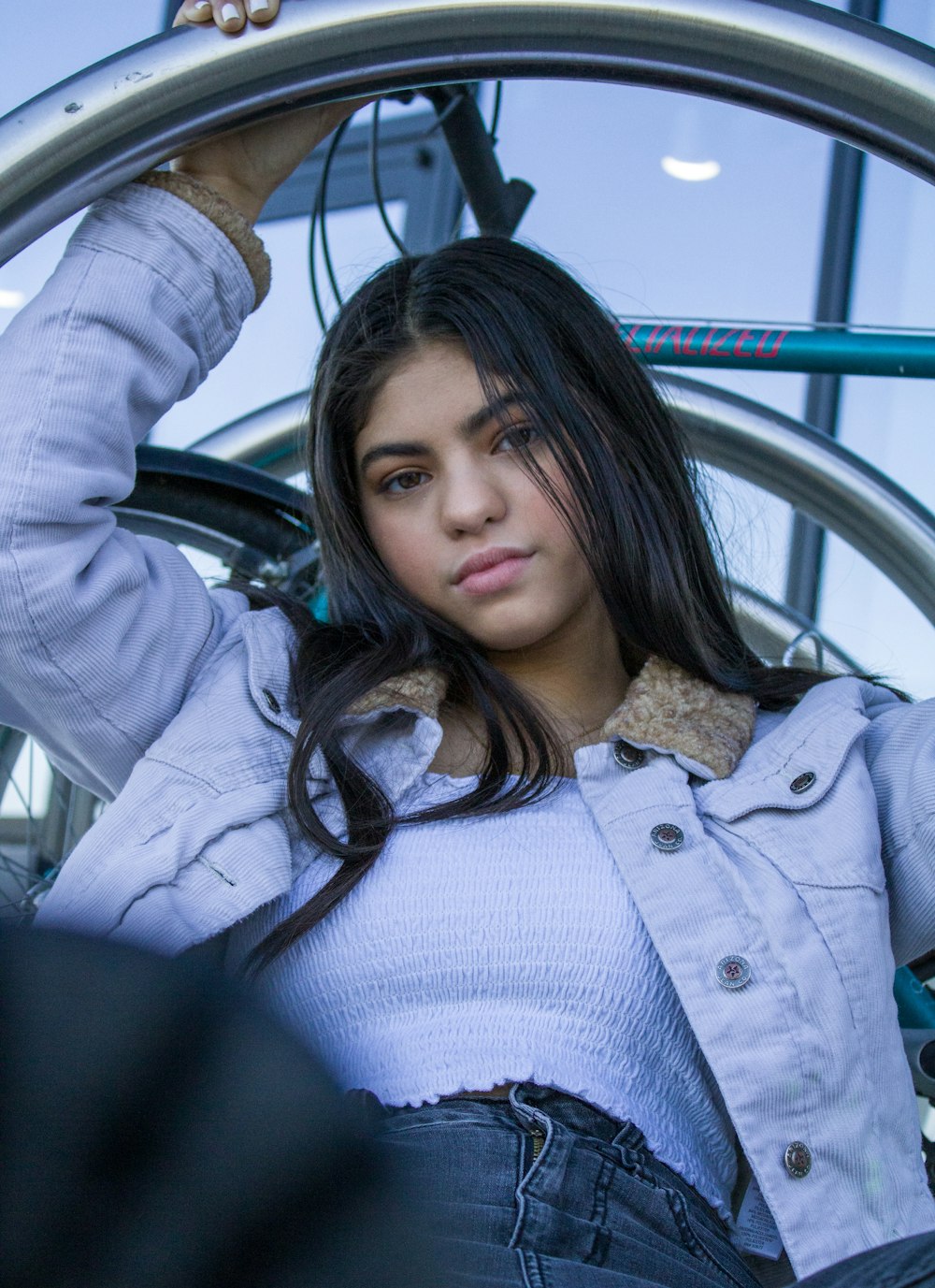 woman in gray button up shirt sitting on black leather car seat