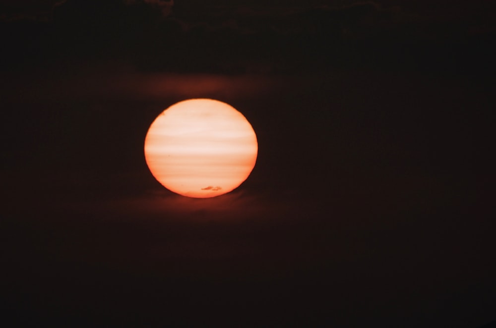 orange round light on dark room