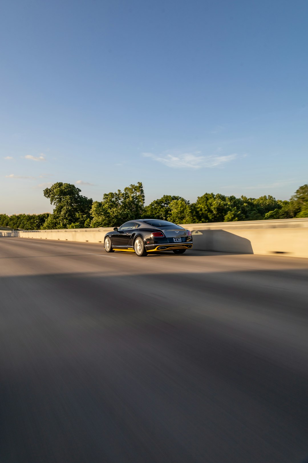 black coupe on brown sand during daytime