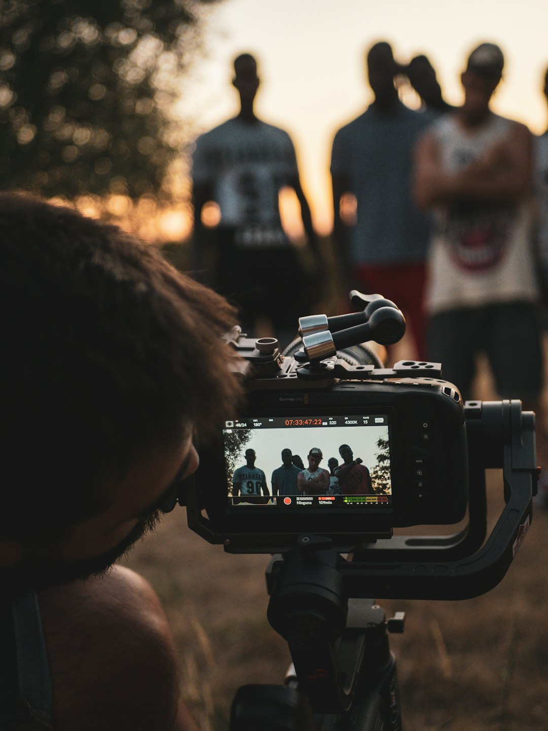 man taking photo of people during daytime