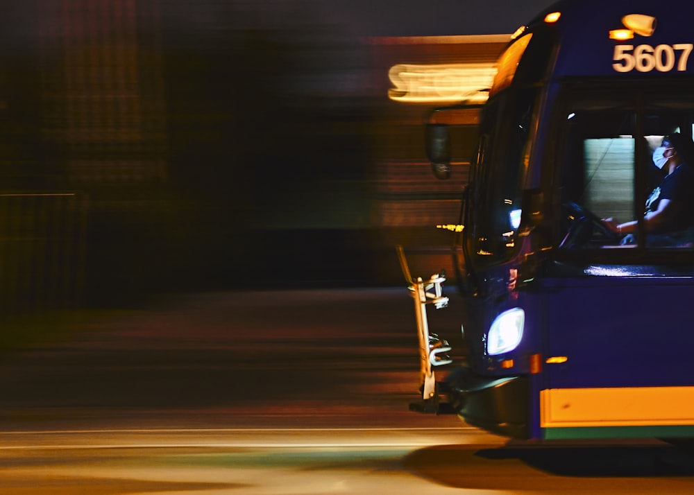 black and yellow auto rickshaw on road during night time