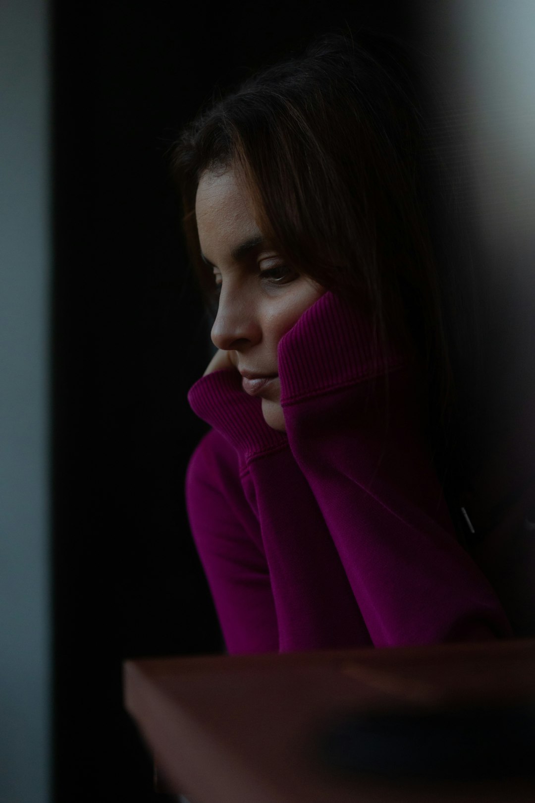 woman in pink turtleneck sweater