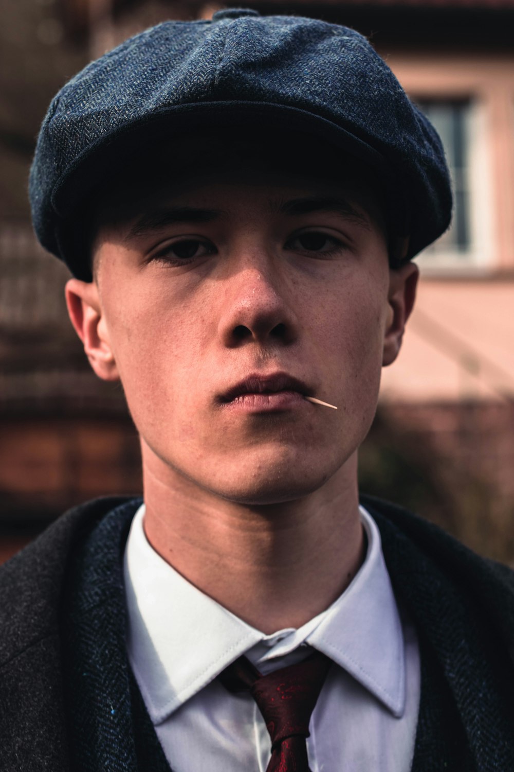 man in black hat and black coat