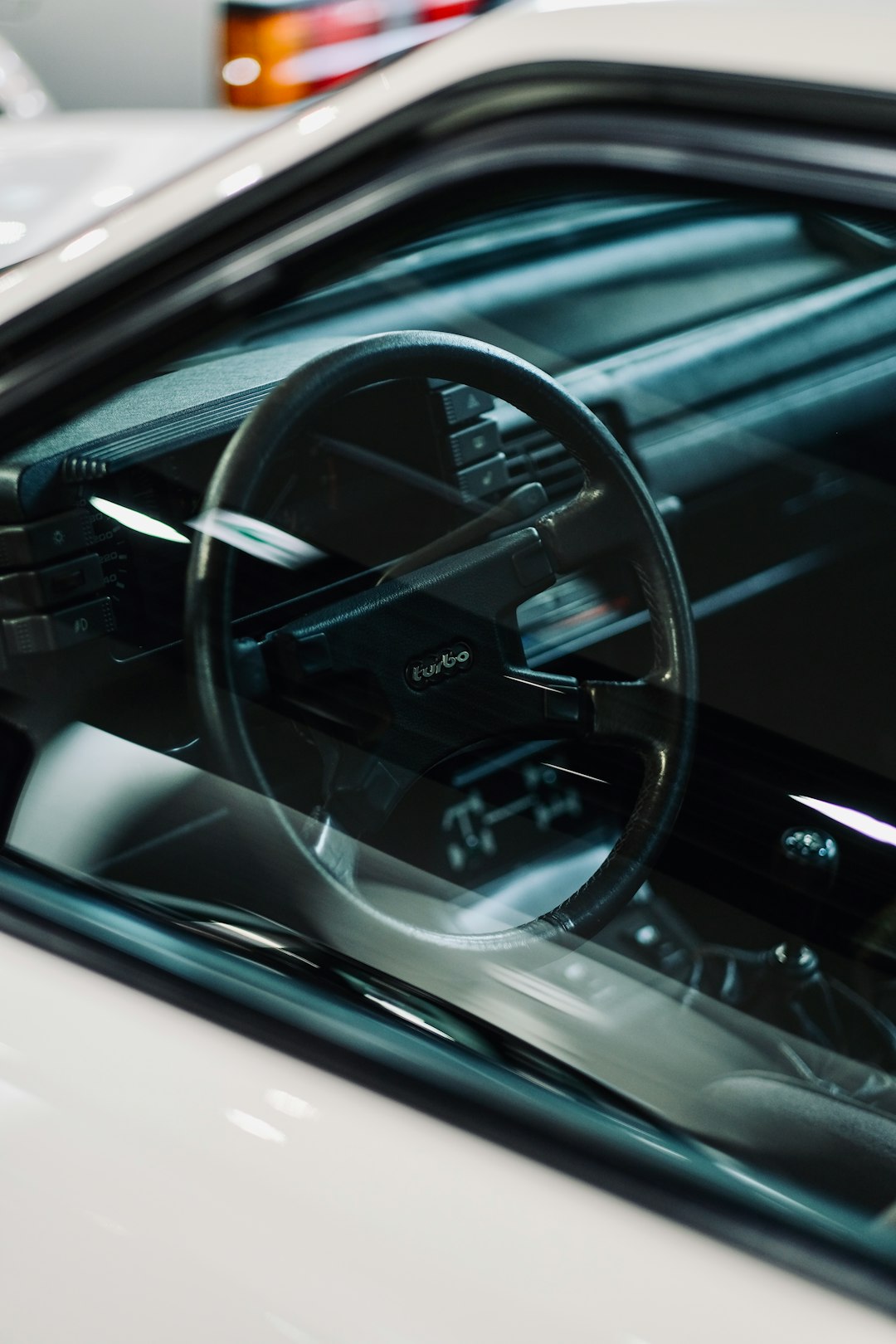 black steering wheel in close up photography